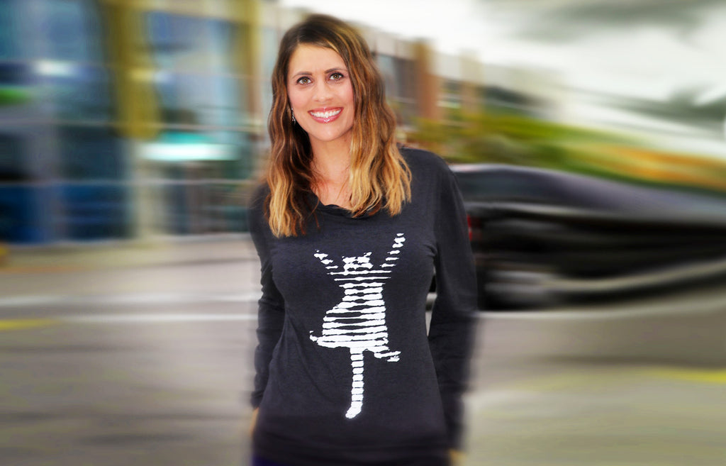 Woman wearing original art cat themed  hoodie shirt.